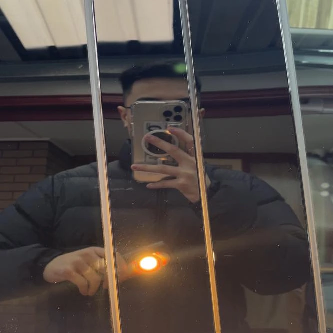 Car paint after correction showing a flawless, mirror-like finish