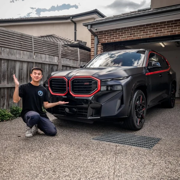 The BMW X5 after paint correction, showing a flawless mirror finish